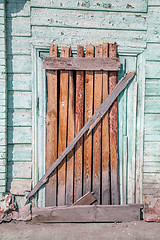 Image showing Old decayed wooden door