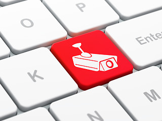 Image showing Protection concept: Cctv Camera on computer keyboard background