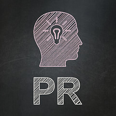 Image showing Marketing concept: Head With Light Bulb and PR on chalkboard background