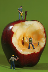 Image showing Construction Workers in Conceptual Imagery With an Apple