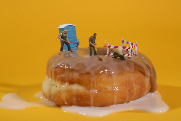 Image showing Police Officers in Conceptual Food Imagery With Doughnuts