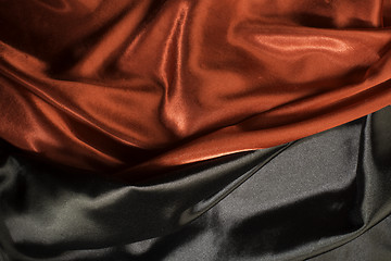 Image showing Shiny black and red satin fabric