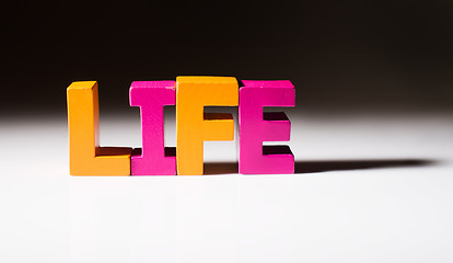 Image showing Multicolored word life made of wood.