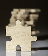 Image showing Wooden puzzle on white background. 