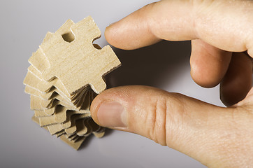 Image showing Wooden puzzle on white background. 