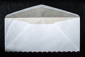 Image showing Open envelope on black background