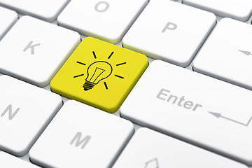 Image showing Finance concept: Light Bulb on computer keyboard background