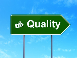 Image showing Advertising concept: Quality and Gears on road sign background