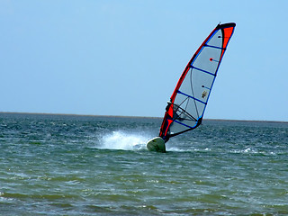 Image showing windsurfer on waves of a gulf in the afternoon