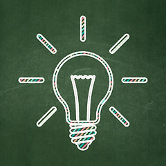 Image showing Finance concept: Light Bulb on chalkboard background