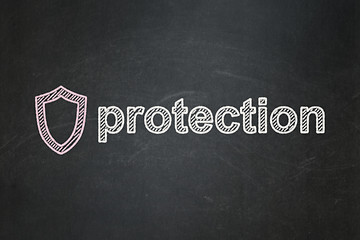 Image showing Protection concept: Contoured Shield and Protection on chalkboard background