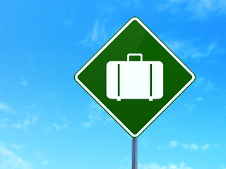 Image showing Vacation concept: Bag on road sign background