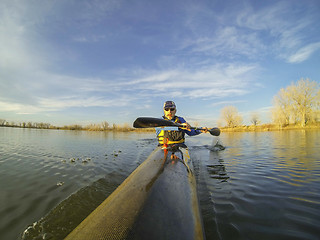 Image showing racing kayak against sunset