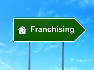 Image showing Business concept: Franchising and Home on road sign background