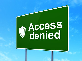 Image showing Privacy concept: Access Denied and Shield on road sign background