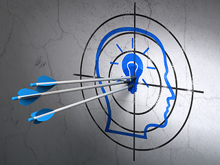 Image showing Business concept: arrows in Head With Lightbulb target on wall background