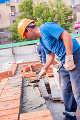 Image showing Bricklayer on house construction