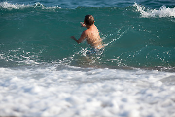 Image showing Little boy in the sea