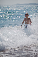 Image showing Happy little boy and sea