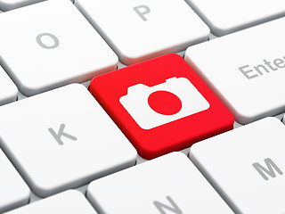 Image showing Tourism concept: Photo Camera on computer keyboard background