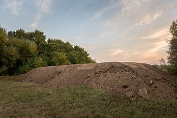 Image showing Large pile of soil under blue sky