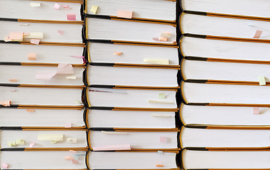 Image showing stack of books with sticky notes