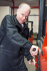 Image showing Chaning a tyre on a forklift