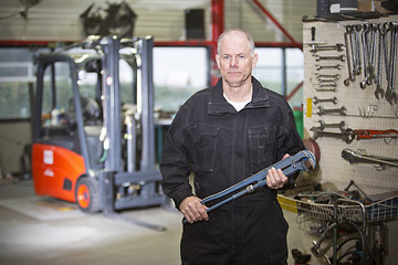 Image showing Mechanic with wrench