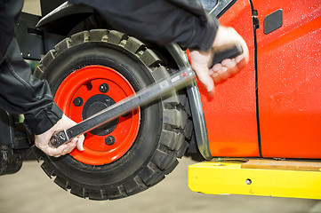 Image showing Chaning a forklift tyre