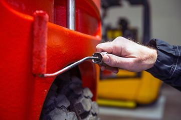 Image showing Painting a forklift