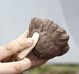 Image showing Working with clay