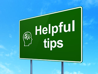 Image showing Education concept: Helpful Tips and Head With Finance Symbol on road sign background