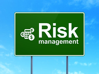 Image showing Finance concept: Risk Management and Calculator on road sign background