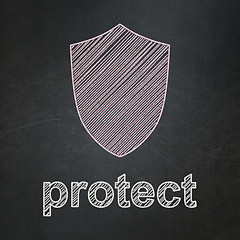 Image showing Privacy concept: Shield and Protect on chalkboard background