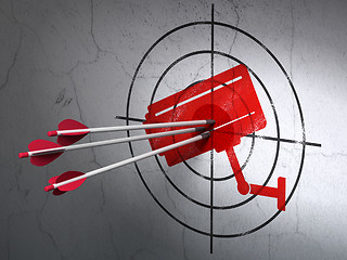 Image showing Protection concept: arrows in Cctv Camera target on wall background