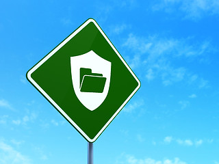 Image showing Business concept: Folder With Shield on road sign background