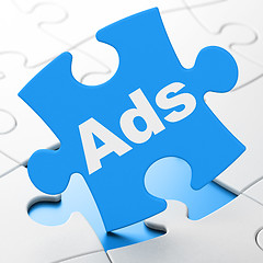 Image showing Marketing concept: Ads on puzzle background