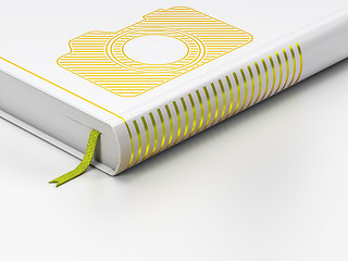 Image showing Travel concept: closed book, Photo Camera on white background