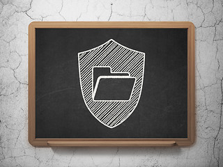 Image showing Finance concept: Folder With Shield on chalkboard background