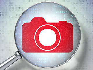 Image showing Vacation concept: Photo Camera with optical glass on digital background