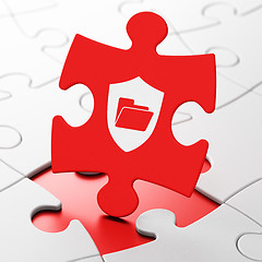 Image showing Business concept: Folder With Shield on puzzle background