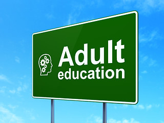 Image showing Education concept: Adult Education and Head With Gears on road sign background