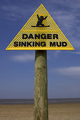 Image showing Danger sinking mud sign, sand point beach England uk