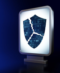 Image showing Security concept: Broken Shield on billboard background