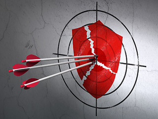 Image showing Safety concept: arrows in Broken Shield target on wall background