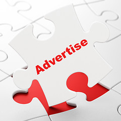 Image showing Advertising concept: Advertise on puzzle background