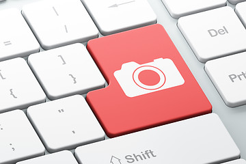 Image showing Travel concept: Photo Camera on computer keyboard background