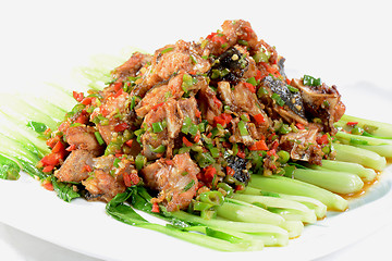 Image showing Chinese Food: Fried fish head pieces with green vegetables