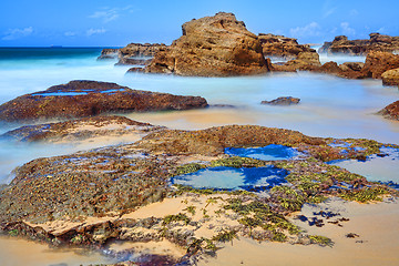 Image showing Long exposure rocks and rock pools at low tide