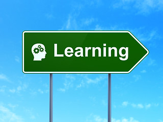 Image showing Education concept: Learning and Head With Gears on road sign background